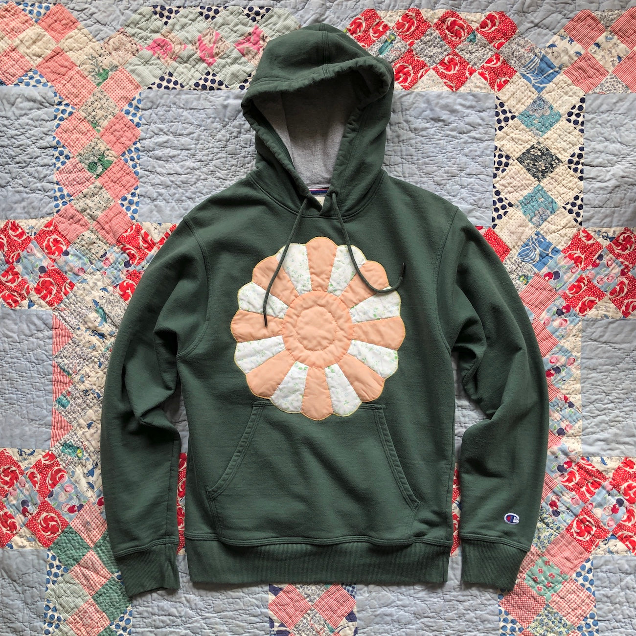 Green Women's Hoodie with Dresden Plate vintage quilt patch sewn to front by Flower Supernova.